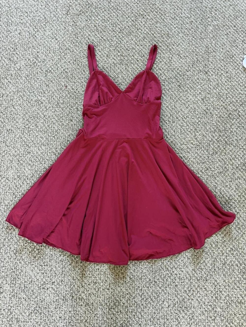 Burgundy red mini dress with a flowy skirt and spaghetti straps